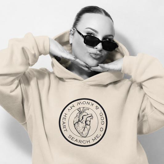 Sophia wearing a beige hoodie with a circular design and text on a light gray background